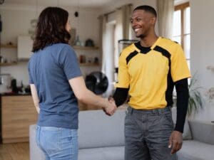 AC tune-up Lynchburg technician greeting homeowner after service visit