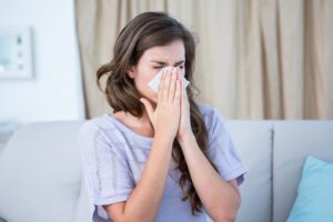 Mold in air ducts Lynchburg - causing woman to sneeze indoors at home