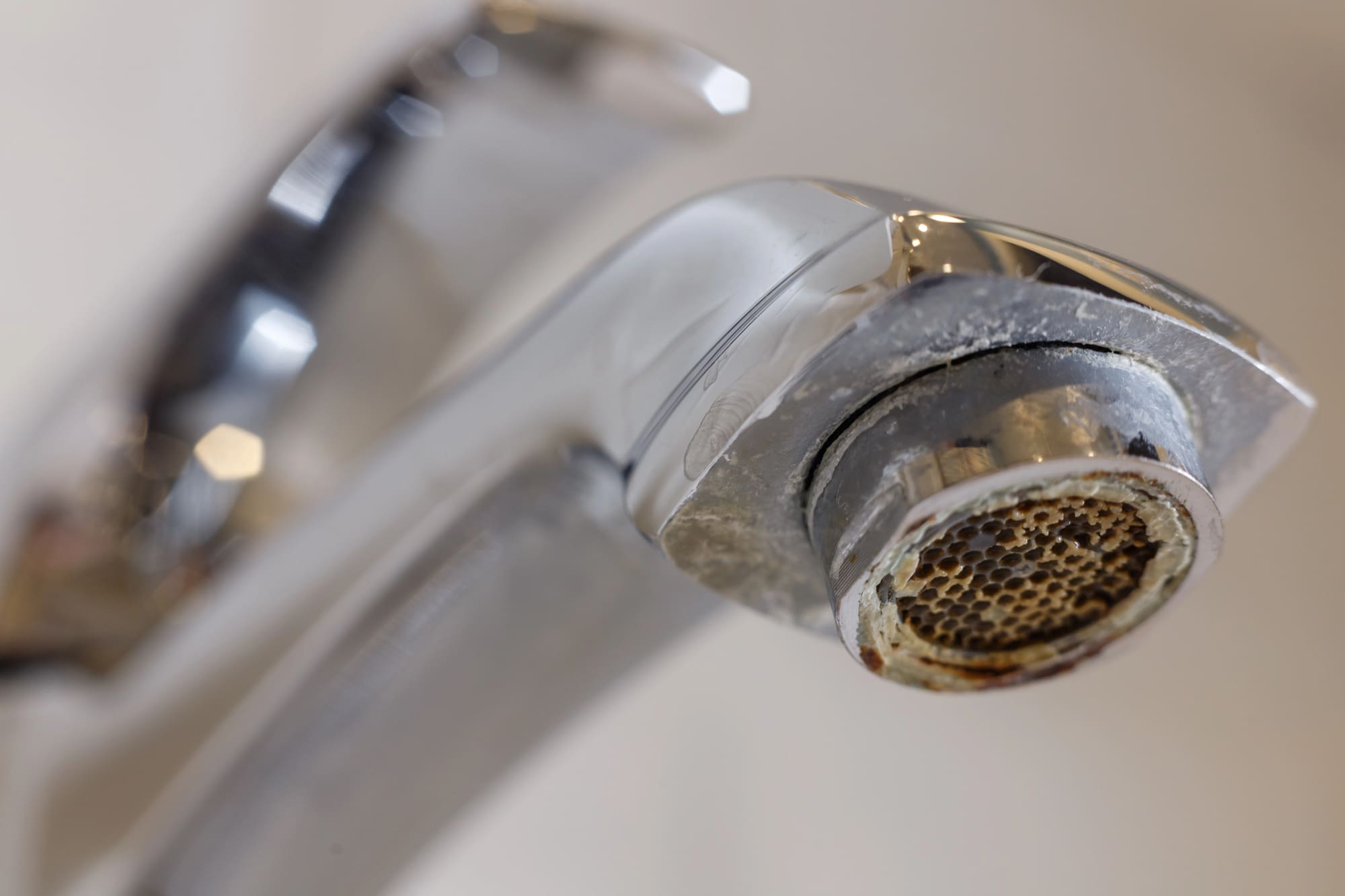 Limescale buildup on faucet from hard well water in Halifax Virginia
