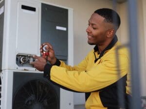 Heat pump lifespan maintenance by Solutions Heating & Cooling technician in Southside Virginia