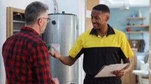 Water heater making noise diagnosis with plumber and homeowner